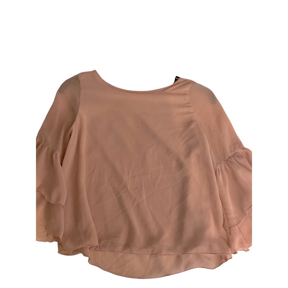 selling a pinkish blouse
